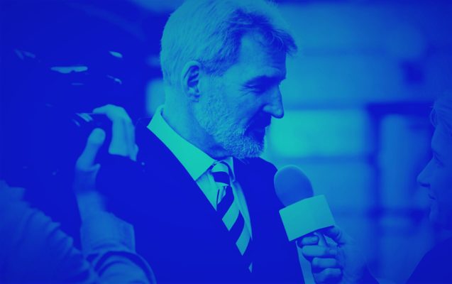 man being interviewed for tv